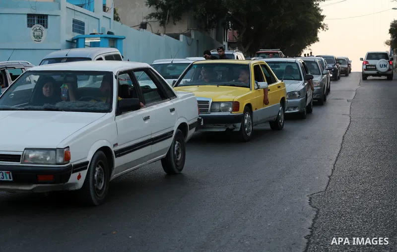Palestinian drivers wait in line to fill their cars in front of a filling station in Gaza City, on September 21, 2015. Due to severe fuel shortages, the Gaza power plant has been operating at approximately half of its ca...