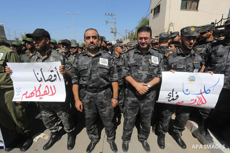 Palestinian members of interior ministry take part a protest against the Israeli police raid on Jerusalem's al-Aqsa mosque, in Gaza city, on Sept. 22, 2015. Israel said thousands of police would be deployed in Jerusalem...