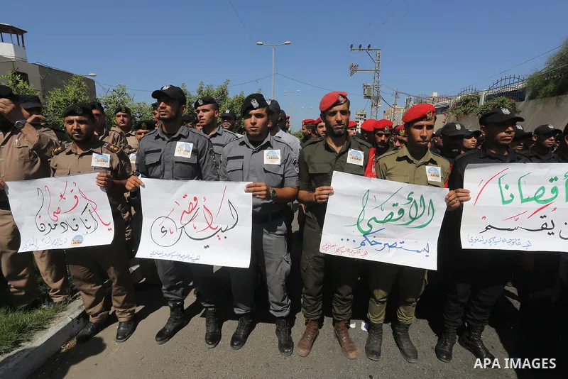 Palestinian members of interior ministry take part a protest against the Israeli police raid on Jerusalem's al-Aqsa mosque, in Gaza city, on Sept. 22, 2015. Israel said thousands of police would be deployed in Jerusalem...