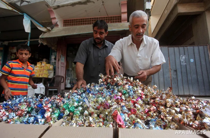 Palestinians shop in a market ahead of the major Muslim festival of Eid al-Adha holiday, in Khan Younis in the southern Gaza strip, on Sept. 23, 2015. Eid al-Adha, or Feast of Sacrifice, commemorates what Muslims believe...