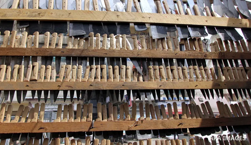 Knives are displayed at a shop ahead of the sacrificial Eid al-Adha festival in Cairo on September 23, 2015. Muslims across the world are preparing to celebrate the annual festival of Eid al-Adha, or the Festival of Sacr...