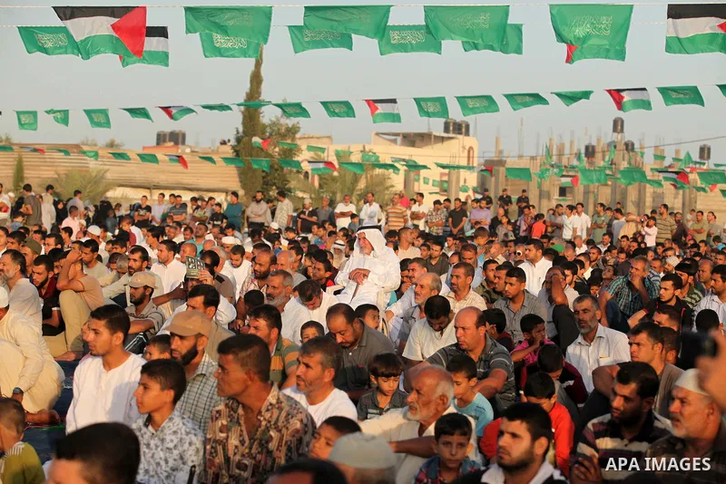 Palestinian muslims pray on the first day of of Eid al-Adha or the feast of sacrifice, in Khan Younis in the southern Gaza Strip on September 24, 2015. Muslims across the world are celebrating the annual festival of Eid...