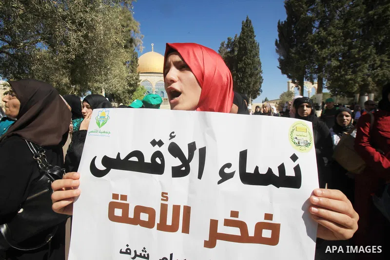 Palestinian women demonstrate in front of the Dome of the Rock after clashes between Palestinian stone throwers and Israeli forces at Jerusalem's Al-Aqsa Mosque compound, one of Islam's holiest sites, on September 27, 20...