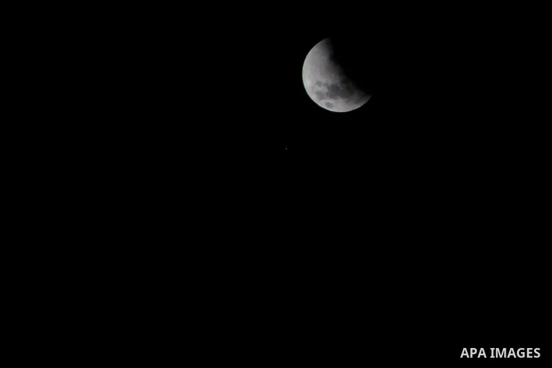 A supermoon is pictured at the beginning of a total lunar eclipse over Cairo, Egypt, September 28, 2015. Sky-watchers around the world are in for a treat Sunday night and Monday when the shadow of Earth casts a reddish g...