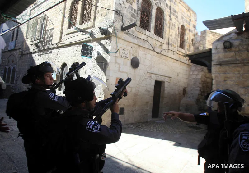 Israeli policemen fire tear gas at Palestinian protesters during clashes at a protest by Palestinians against what they see as interference by Israeli authorities in the al-Aqsa mosque compound, Islam s third holiest sit...