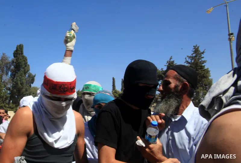 Palestinian protesters celebrate following clashes with Israeli security forces at a protest against what they see as interference by Israeli authorities in the al-Aqsa mosque compound, Islam s third holiest site, on Sep...