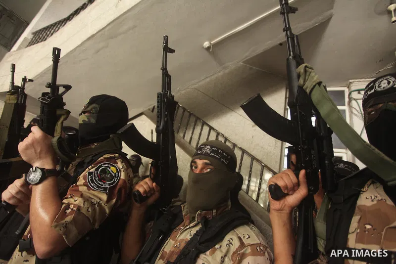 Palestinian militants of the Nasser Salah al-Din Brigades the military wing of the Popular Resistance Committees take part in a press conference, in Gaza City on Sept. 29, 2015. Photo by Ashraf Amra