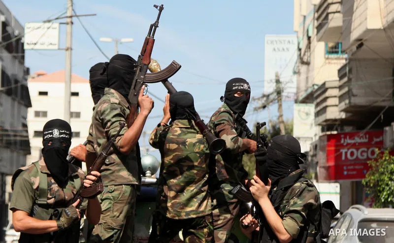 Palestinian militants of the Nasser Salah al-Din Brigades the military wing of the Popular Resistance Committees take part in a press conference, in Gaza City on Sept. 29, 2015. Photo by Ashraf Amra