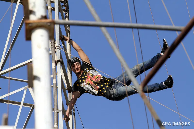 A member of Palestinian '3run Gaza' team, practices his parkour skills on a building in preparation for the "Gulf Monster", the first Arab parkour competition in Qatar in November 2015, in Gaza city on September 29, 2015...