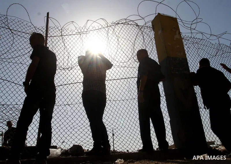 Palestinians wait for their pilgrim relatives at the Rafah crossing between Gaza Strip and Egypt after performing the annual Hajj, in Rafah in southern Gaza Strip, September 30, 2015. Around 500 Hajj pilgrims cross Rafah...