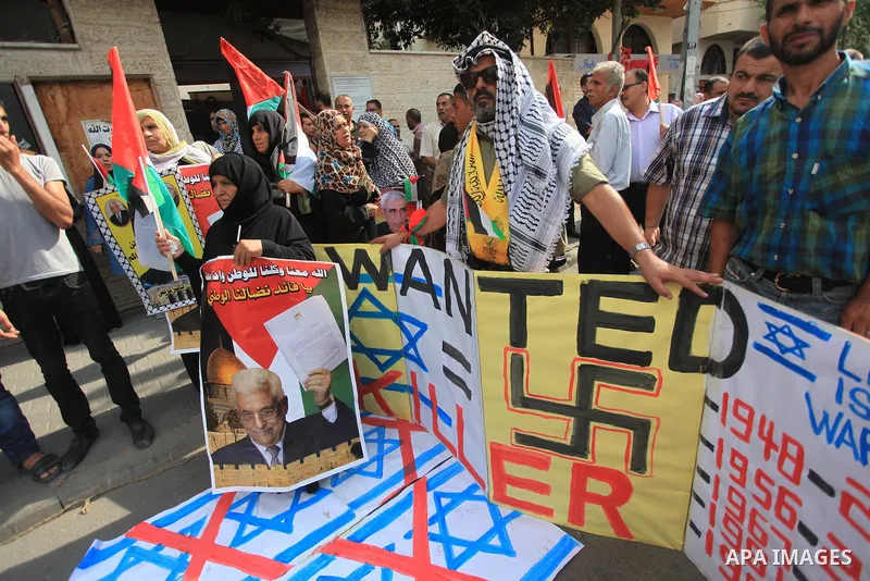 Relatives of Palestinian prisoners in Israeli jails, take part in a protest to show solidarity with Palestinians clashing with Israeli security forces at Jerusalem's al-Aqsa mosque, outside the Red Cross office, in Gaza...