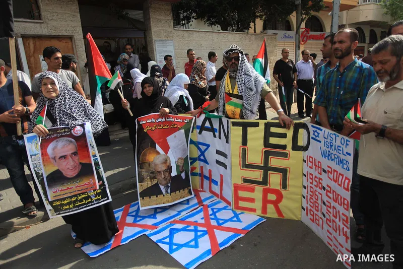 Relatives of Palestinian prisoners in Israeli jails, take part in a protest to show solidarity with Palestinians clashing with Israeli security forces at Jerusalem's al-Aqsa mosque, outside the Red Cross office, in Gaza...