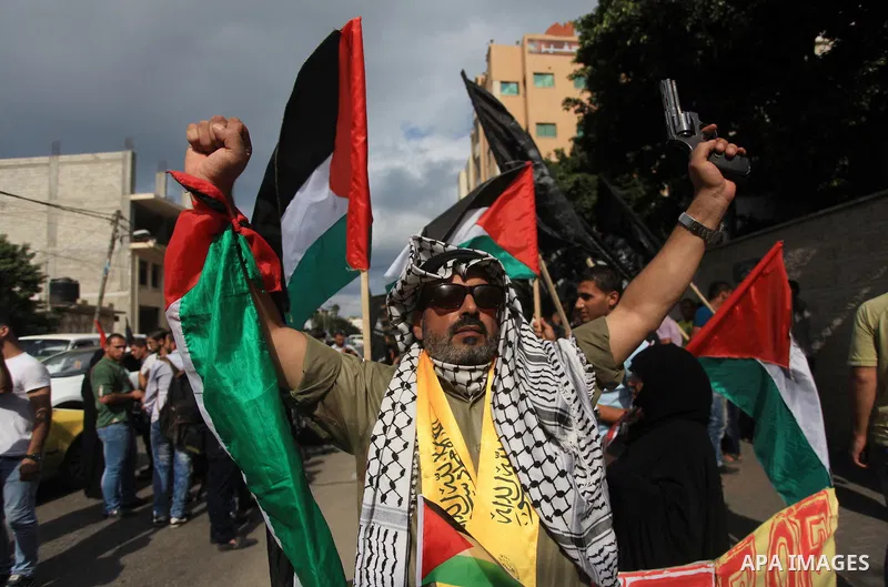 Relatives of Palestinian prisoners in Israeli jails, take part in a protest to show solidarity with Palestinians clashing with Israeli security forces at Jerusalem's al-Aqsa mosque, outside the Red Cross office, in Gaza...