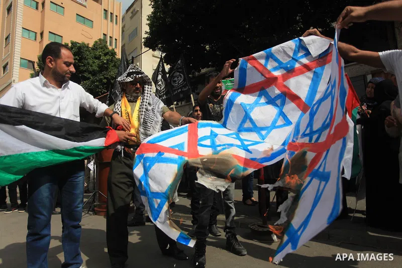 Relatives of Palestinian prisoners in Israeli jails, take part in a protest to show solidarity with Palestinians clashing with Israeli security forces at Jerusalem's al-Aqsa mosque, outside the Red Cross office, in Gaza...