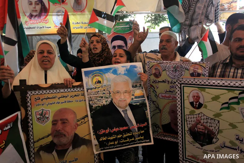 Relatives of Palestinian prisoners in Israeli jails, take part in a protest to show solidarity with Palestinians clashing with Israeli security forces at Jerusalem's al-Aqsa mosque, outside the Red Cross office, in Gaza...