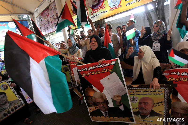 Relatives of Palestinian prisoners in Israeli jails, take part in a protest to show solidarity with Palestinians clashing with Israeli security forces at Jerusalem's al-Aqsa mosque, outside the Red Cross office, in Gaza...