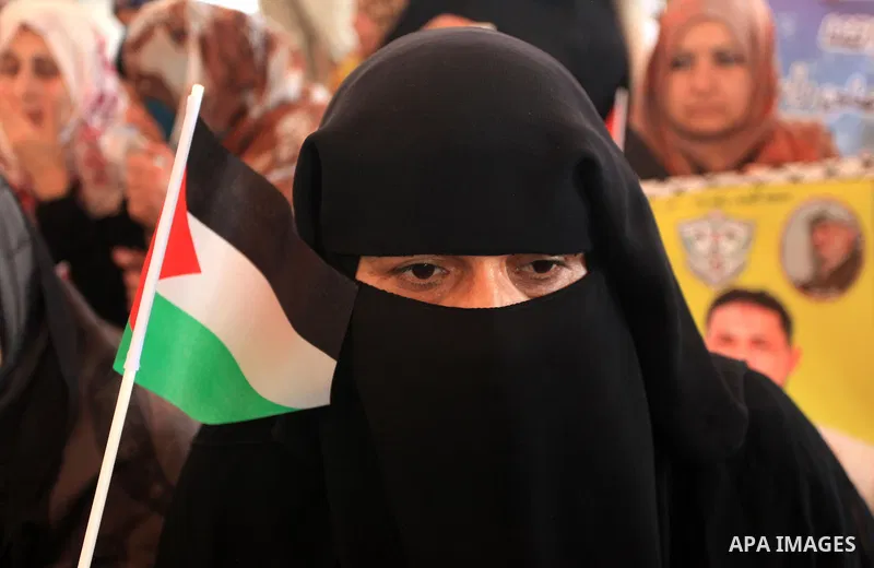 Relatives of Palestinian prisoners in Israeli jails, take part in a protest to show solidarity with Palestinians clashing with Israeli security forces at Jerusalem's al-Aqsa mosque, outside the Red Cross office, in Gaza...
