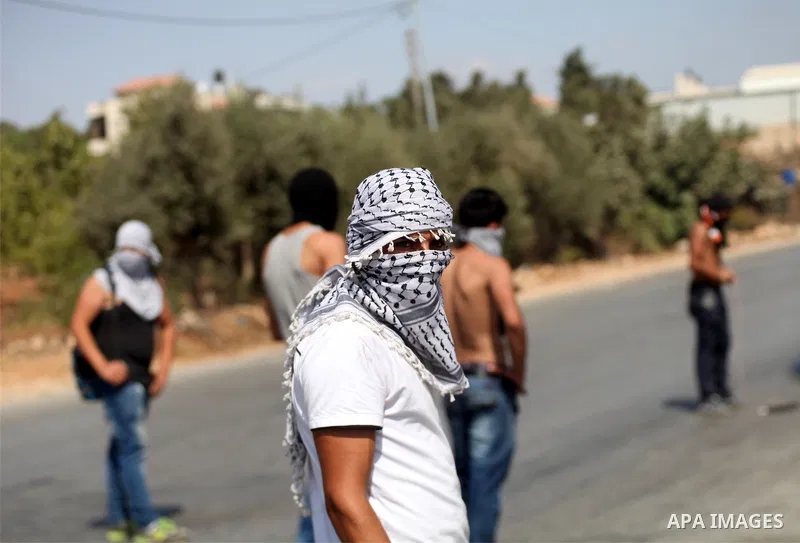 Palestinian protesters throw stones towards Israeli troops during clashes near the Jewish settlement of Bet El, near the occupied West Bank city of Ramallah October 5, 2015. Violence intensified in Jerusalem and the West...