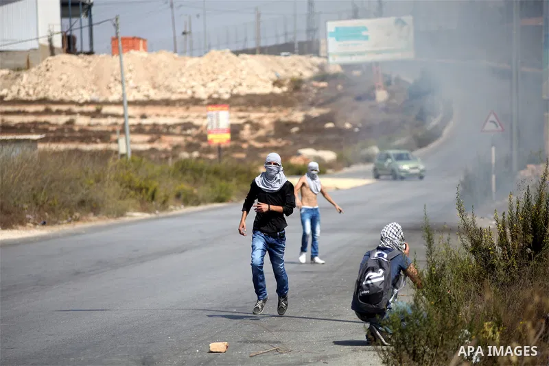 Palestinian protesters throw stones towards Israeli troops during clashes near the Jewish settlement of Bet El, near the occupied West Bank city of Ramallah October 5, 2015. Violence intensified in Jerusalem and the West...