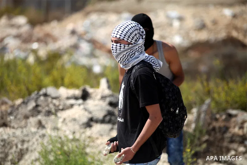 Palestinian protesters throw stones towards Israeli troops during clashes near the Jewish settlement of Bet El, near the occupied West Bank city of Ramallah October 5, 2015. Violence intensified in Jerusalem and the West...