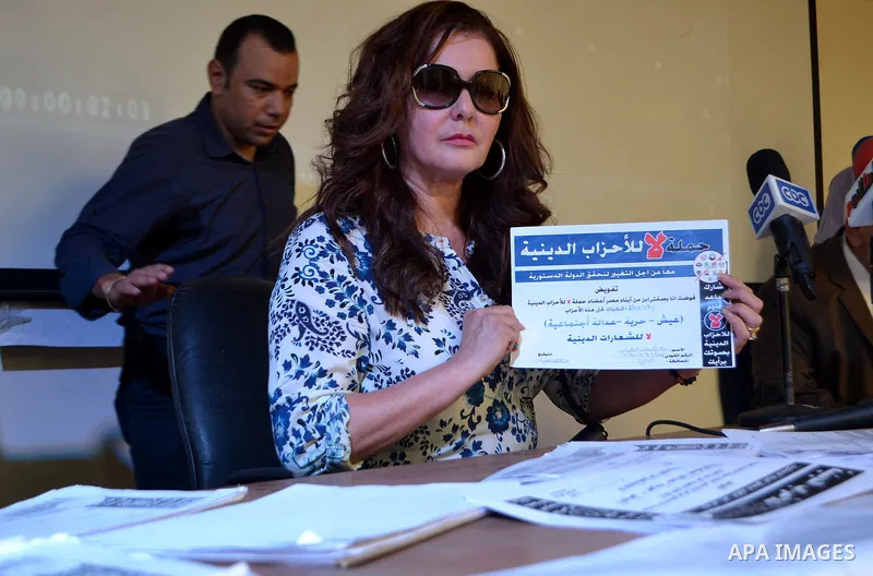 Egyptian actress Athar al-Hakim, takes part in the campaign of 'No to religious parties', in Cairo on October 11, 2015. Liberal activists and politicians in Egypt launched a campaign aimed at driving the public away from...