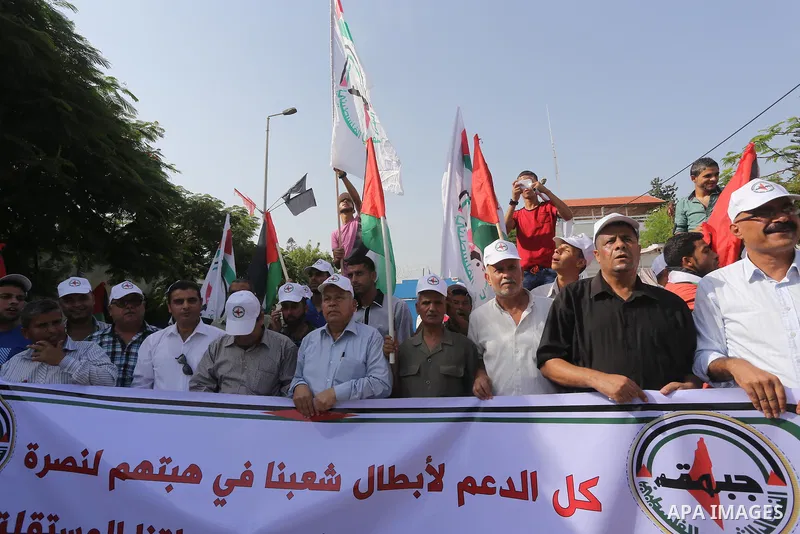 Palestinians take part in a protest in solidarity with Palestinians in the West Bank and against Jewish groups visiting the al-Aqsa mosque compound, in Gaza city on October 12, 2015. Photo by Mohammed Asad
