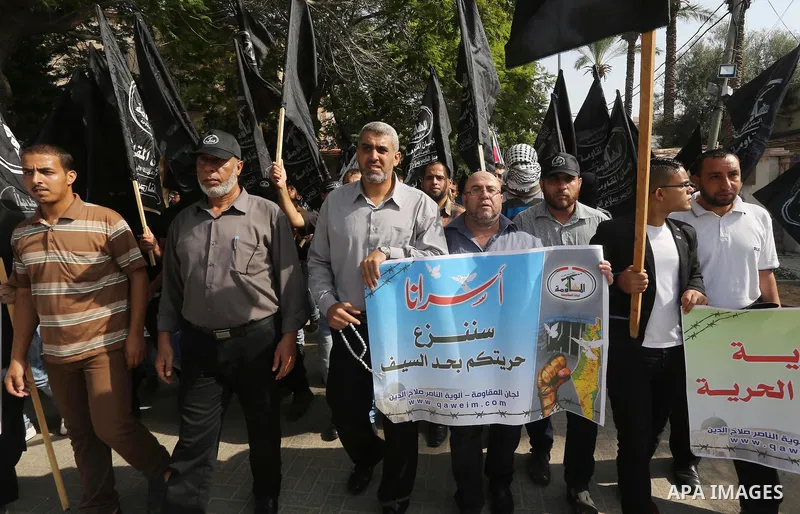 Palestinians take part in a protest in solidarity with Palestinians in the West Bank and against Jewish groups visiting the al-Aqsa mosque compound, in Gaza city on October 12, 2015. Photo by Mohammed Asad