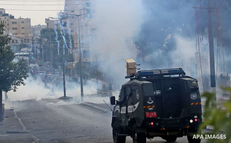 Palestinian protesters throw stones at Israeli security forces during clashes in the West Bank city of Bethlehem, on October 13, 2015. A wave of stabbings that hit Israel, Jerusalem and the West Bank this month along wit...