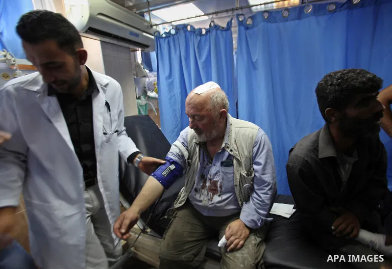 British Volunteer, David Amos, receives treatment at Rafidia hospital after Israeli settlers attack him as he was help Palestinian farmers in the West Bank village of Burin on Oct. 14, 2015. Israel began setting up check...