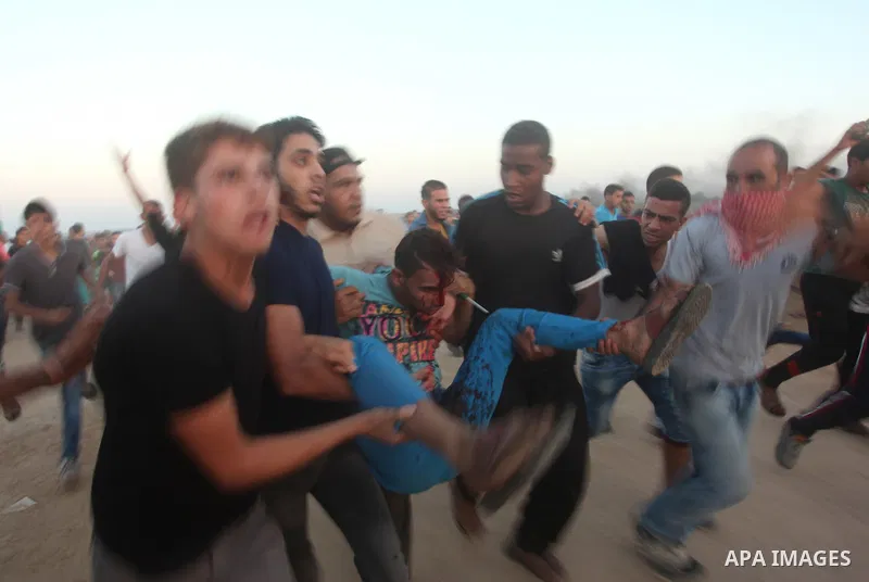Palestinian protesters clash with Israeli troops near the border between Israel and central Gaza Strip October 15, 2015. Thirty-two Palestinians and seven Israelis have been killed in the past two weeks of bloodshed. The...