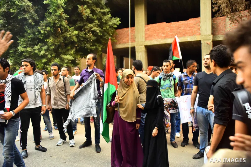 Egyptian protesters shot slogans during a demonstration expressing solidarity with Palestinians, outside the Palestinian Embassy in Cairo, October 16, 2015. According to local reports a group of protesters expressed thei...