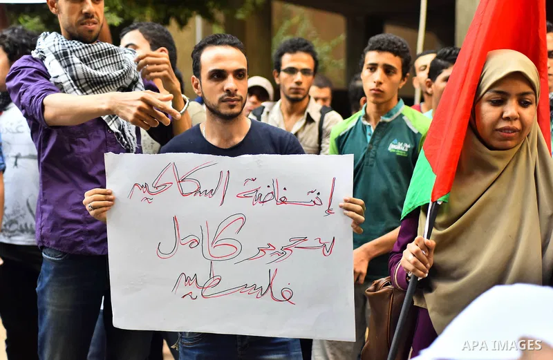 Egyptian protesters shot slogans during a demonstration expressing solidarity with Palestinians, outside the Palestinian Embassy in Cairo, October 16, 2015. According to local reports a group of protesters expressed thei...
