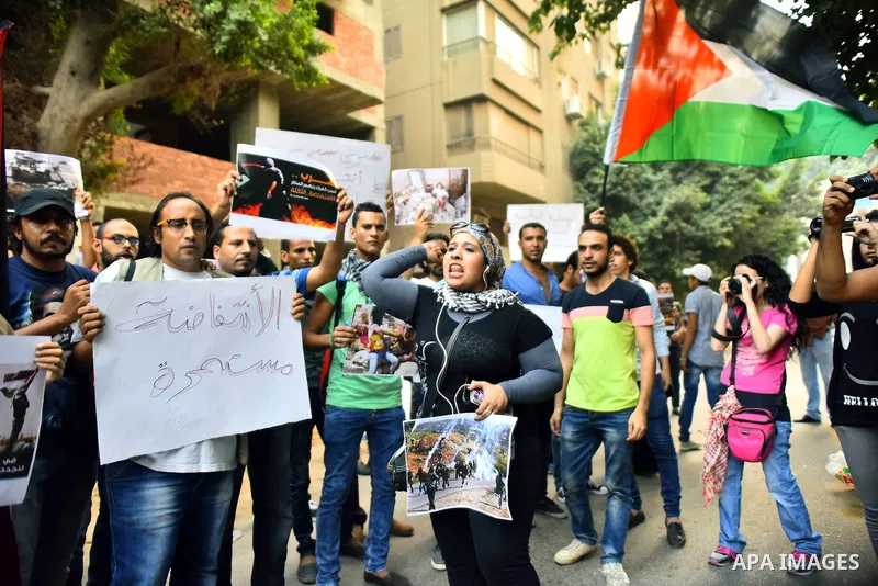 Egyptian protesters shot slogans during a demonstration expressing solidarity with Palestinians, outside the Palestinian Embassy in Cairo, October 16, 2015. According to local reports a group of protesters expressed thei...