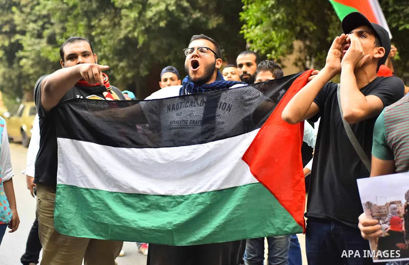Egyptian protesters shot slogans during a demonstration expressing solidarity with Palestinians, outside the Palestinian Embassy in Cairo, October 16, 2015. According to local reports a group of protesters expressed thei...