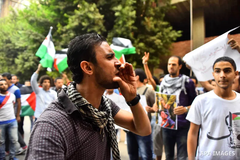 Egyptian protesters shot slogans during a demonstration expressing solidarity with Palestinians, outside the Palestinian Embassy in Cairo, October 16, 2015. According to local reports a group of protesters expressed thei...
