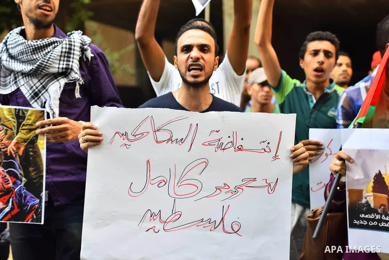 Egyptian protesters shot slogans during a demonstration expressing solidarity with Palestinians, outside the Palestinian Embassy in Cairo, October 16, 2015. According to local reports a group of protesters expressed thei...