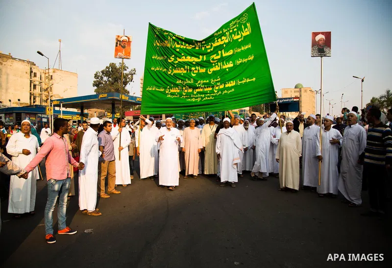 Egyptian Muslim Sufis march during a parade through the streets during a ceremony to celebrate the Islamic new year, in Cairo on October 16, 2105. Photo by Amr Sayed