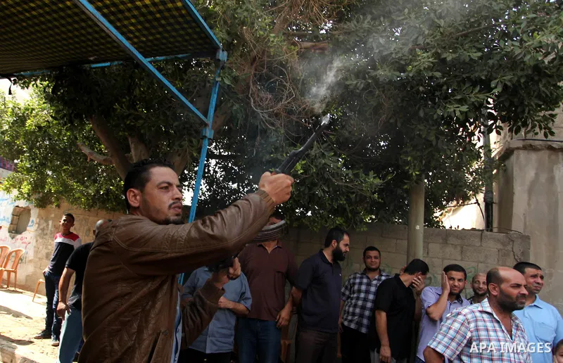 Relatives of Palestinian Mahmoud Hmead, 22, who was killed by Israeli troops in Friday's clashes, mourn during his funeral in Gaza October 17, 2015. The unrest that has engulfed Jerusalem, Gaza and the occupied West Bank...