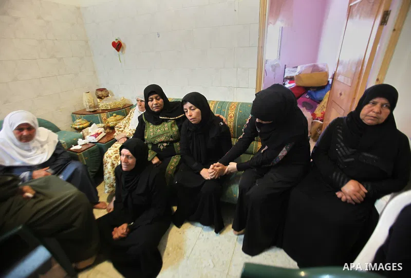 Relatives of Palestinian Ihab Hanani, 19, mourn during his funeral at Beit Furik village near the West Bank city of Nablus, on October 17, 2015. The unrest that has engulfed Jerusalem, Gaza and the occupied West Bank, th...