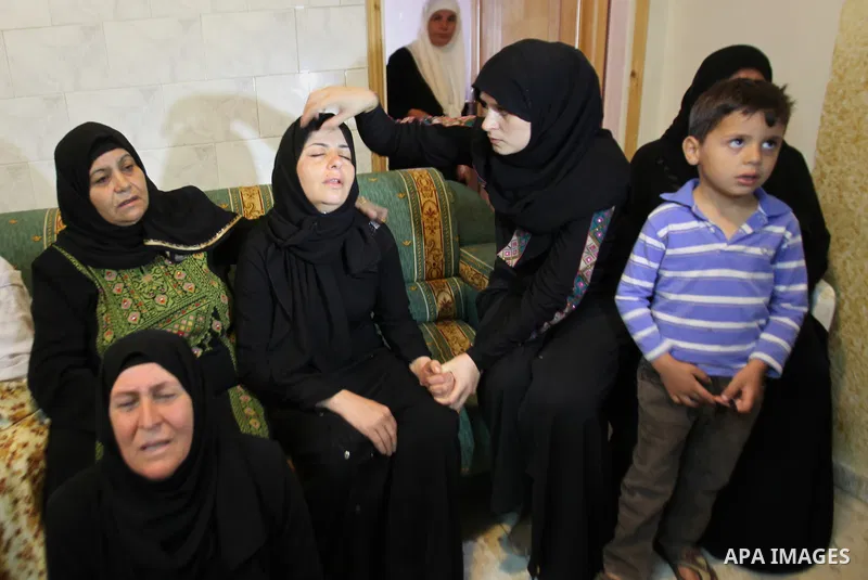 Relatives of Palestinian Ihab Hanani, 19, mourn during his funeral at Beit Furik village near the West Bank city of Nablus, on October 17, 2015. The unrest that has engulfed Jerusalem, Gaza and the occupied West Bank, th...