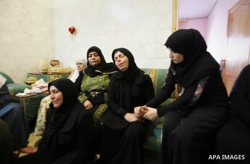 Relatives of Palestinian Ihab Hanani, 19, mourn during his funeral at Beit Furik village near the West Bank city of Nablus, on October 17, 2015. The unrest that has engulfed Jerusalem, Gaza and the occupied West Bank, th...
