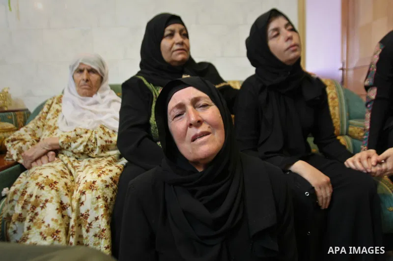 Relatives of Palestinian Ihab Hanani, 19, mourn during his funeral at Beit Furik village near the West Bank city of Nablus, on October 17, 2015. The unrest that has engulfed Jerusalem, Gaza and the occupied West Bank, th...