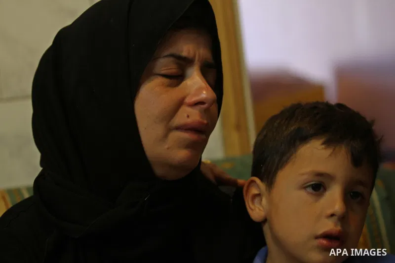 The Mother of Palestinian Ihab Hanani, 19, mourns during his funeral at the Bet Forik village near the West Bank city of Nablus, on October 17, 2015. The unrest that has engulfed Jerusalem, Gaza and the occupied West Ban...