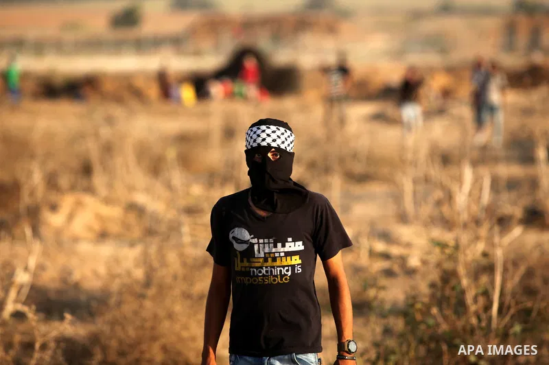 Palestinian protesters clash with Israeli security forces near the border between Israel and Central Gaza Strip east of Bureij on October 17, 2015. At least 40 Palestinians and seven Israelis have died in more than two w...
