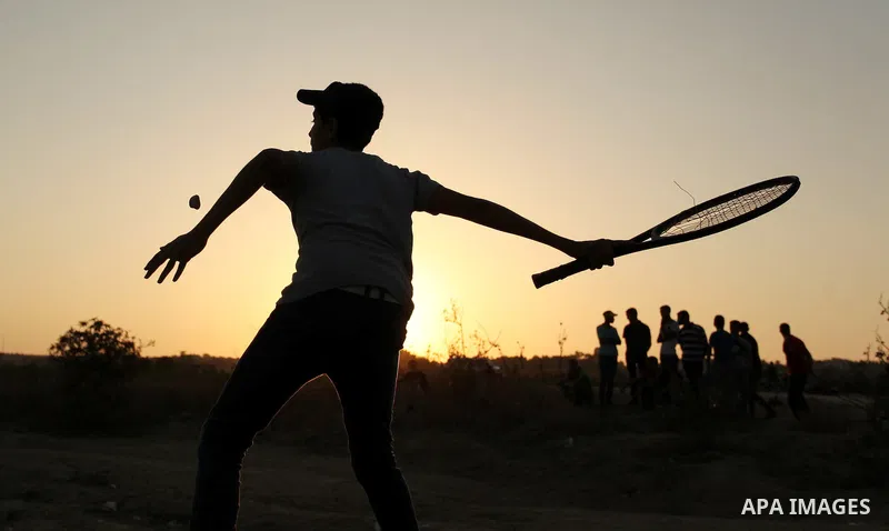 Palestinian protesters hurl stones at Israeli troops during clashes near the border between Israel and Central Gaza Strip east of Bureij on October 17, 2015. At least 40 Palestinians and seven Israelis have died in more...