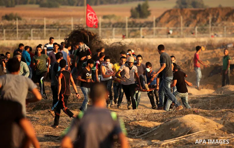 Palestinian protesters clash with Israeli security forces near the border between Israel and Central Gaza Strip east of Bureij on October 17, 2015. At least 40 Palestinians and seven Israelis have died in more than two w...