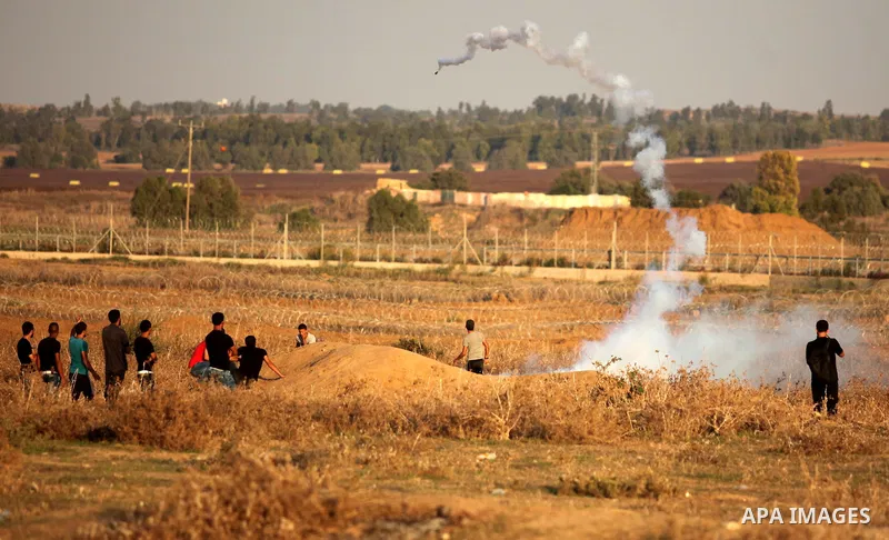 Palestinian protesters clash with Israeli security forces near the border between Israel and Central Gaza Strip east of Bureij on October 17, 2015. At least 40 Palestinians and seven Israelis have died in more than two w...