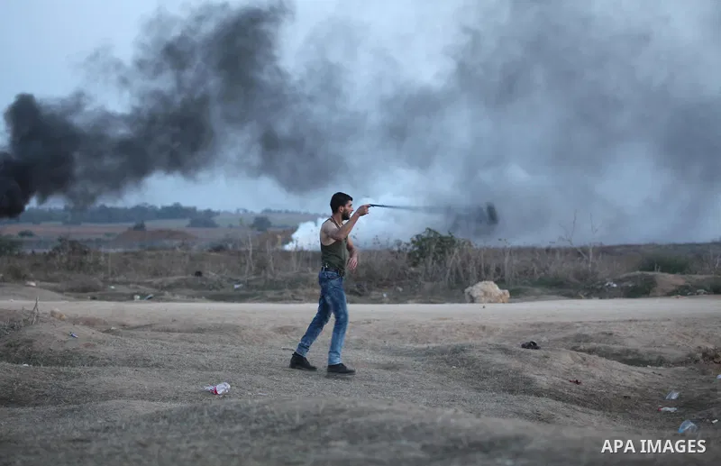 Palestinian protesters hurl stones at Israeli troops during clashes near the border between Israel and Central Gaza Strip east of Bureij on October 17, 2015. At least 40 Palestinians and seven Israelis have died in more...