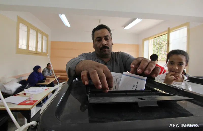 An Egyptian man casts his ballot in the Egyptian parliamentary elections at a polling station in the Al-Ayyat area of Giza, 40kms (25 miles) southwest of Cairo, on October 18, 2015. Polling opened earlier in the day in E...