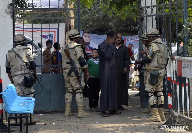 Egyptians participate in the election voting at a polling station in Giza governorate, Egypt, October 18, 2015. Egypt's long-awaited parliamentary election got off to a slow start on Sunday, marking the final step in a p...